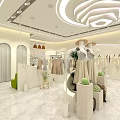 Stylish Clothing Store With White Interior Mannequins Hanging Clothes And Plants