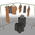 Clothing Rack with Hanging Neutral Tones Plaid Shirts and Silver Handbag on Wooden Stump Bases