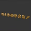 Golden Decorative Ornaments Featuring Various Geometric And Floral Shapes On Dark Surface