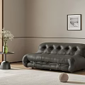 Modern Tufted Leather Double Sofa With Side Table Vase And Decorative Painting