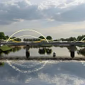 Scenic Arched Bridge Over Water With Reflection Green Trees And Cloudy Sky
