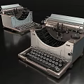Vintage Office Appliances Two Classic Typewriters On Black Surface