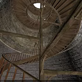 Spiral Staircase In Stone Tower Interior With Wooden Steps And Support Beams