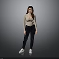 Woman in beige long sleeve top and dark jeans with white sneakers against gray background