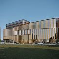Modern Office Building With Golden Vertical Stripes Glass Facade And Green Lawn