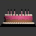 Delicious Pink Frosted Cake With White Decorative Balls And Black Candles On Black Tray