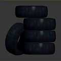 Multiple Stacked Black Rubber Tires for Automotive Vehicle Use and Storage