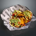 Fresh Tacos Topped with Guacamole and Tortilla Chips in TACOS Printed Paper Wrap