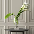Transparent Glass Vase With White Calla Lilies And Green Leaves On Decorative Wall Background