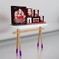 Organized Dressing Table With Makeup Products And Display Images On White Top
