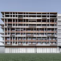 Modern Multi Storey Office Building Exterior With Glass Windows And Balconies On Green Lawn