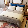 Double Bed with Wooden Headboard Background Wall Painting Blue White Pillows Nightstands Lamps Decorative Rug