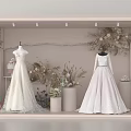 Elegant Bridal Shop Window Display With Lace Wedding Dresses And Floral Decorations