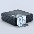 Black Leather Ottoman with Diamond Tufted Design and Silver Fabric Accent