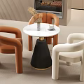Modern Single Sofa Design In Orange And White With Curved Arms And Round Coffee Table