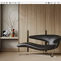 Modern Black Leather Chaise Lounge With Metal Frame By Wooden Wall And Shelf