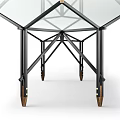 Sleek Glass Top Table With Black Metal Frame And Rolling Wheels Design