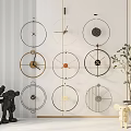 Modern Wall Mounted Circular Clocks With Metal Frames And Decorative Figurines Near Potted Plant