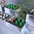 Modern Dessert Display With Green Confections White Cone Treats And Green Plants On Shelves