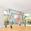 Foldable Clothes Drying Rack With Wheels Holding Baby Clothes Towels Quilt In Room With Window