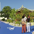 Scenic Garden Landscape With Tall Trees Green Grass Pergola Pathway And Walking Area