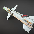White Military Missile Model With Tail Fins Yellow Blue Rings And Warhead Section