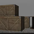 Stacked Wooden Crates With Black Cable Beside On Gravel Ground