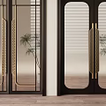 Elegant Black Double Doors with Golden Handles Glass Panels Arched Top and Potted Plants