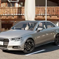 Silver Audi Sedan Parked On Roadside With Wooden Building Background And Alloy Wheels