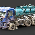 Old Blue Tanker Truck With Large Green Storage Tank Multiple Wheels And Worn Exterior