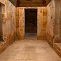 Ancient Egyptian Tomb Chamber With Stone Walls Hieroglyphs And Wall Paintings