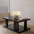 Modern Coffee Table With Black Tabletop Metal Base Table Lamp And Books