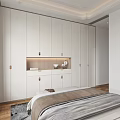 Modern Bedroom With Built In White Wardrobes Brass Handles Gray Brown Bedding And Wooden Flooring