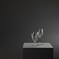 Two Elegant Transparent Wine Glasses Placed On Grey Table Against Dark Background