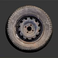 Stack of Used Car Tires with Metal Rims and Worn Tread Surface