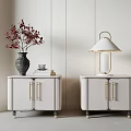 Elegant Minimalist White Bedside Tables with Gold Handles Vase with Red Flowers Books and Lamp