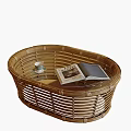 Oval Shaped Wicker Coffee Table With Open Book And Cup On Top