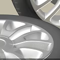 Car Tires Featuring Silver Spoke Wheels And Detailed Tread Pattern Design