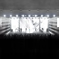 Fashion Runway Show with Bright Stage Lights Large Screen Models Live Band and Audience