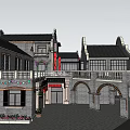 Chinese Style Commercial Complex With Gray Bricks Black Tiles Arched Doors And Decorated Balconies