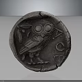 Ancient Silver Coin Featuring Owl Design With Olive Branch And Cracked Surface