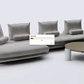 Modern Gray Sectional Sofa With Plush Pillows And Round Wooden Coffee Table 3d model