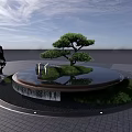 Circular Water Fountain with Small Tree Grass Black Pebbles Under Blue Sky Two People Walking