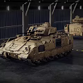 Two Sand Colored Military Tanks With Tracks Parked In Industrial Warehouse