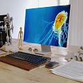 Dual Computer Monitors Setup With Keyboard Mouse And Desk Lamp On Wooden Office Desk