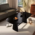 Sleek Black Coffee Table On Light Colored Rug With Fruit Bowl Open Book And Decorative Plant