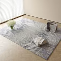 Square Carpet with Blue Gray Design on Wooden Floor Featuring White Flowers Magazines and Clothes