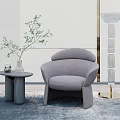 Gray Single Sofa with Side Table Potted Plant and Modern Floor Lamp in Contemporary Interior
