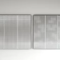 Two Silver Metal Panels With Different Perforated Patterns Side By Side On White Wall 3d model
