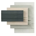 Various Toned Curtain Fabric Samples with Textured Surfaces Stacked for